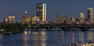 Caption: Boston's skyline in 2014. Photo via Bill Damon on Wikimedia (CC BY 2.0).
