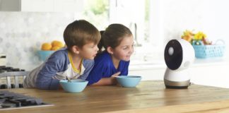 Jibo hanging out with two children. Photo from Jibo's press kit.